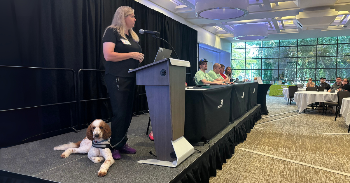 Nikki Brown, PhD, executive director for Canines for Change, speaks at the 9th Annual Autism and Neurodevelopmental Disorders Conference Family and Professionals Conference on Thursday, July 24, 2025, at the Kellogg Center.